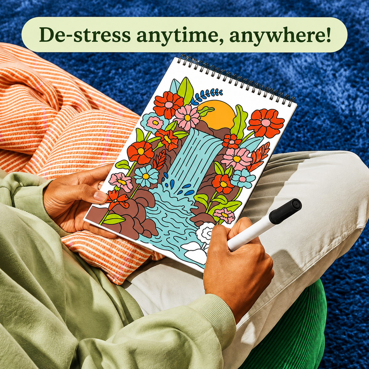 Person coloring a guided art page at home