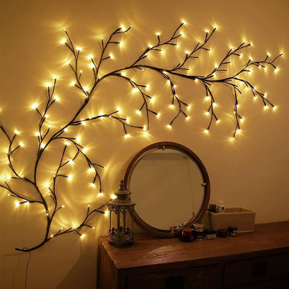 Decorative wall light fixture shaped like branches with glowing lights on a wall.